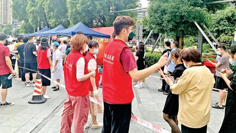 全区近9万人次志愿者在核酸检测点提供志愿服务